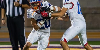 Los Altos running back fights through a tackle from a Diamond Bar defender during their 49-35 comeback win to remain undefeated at 9-0.