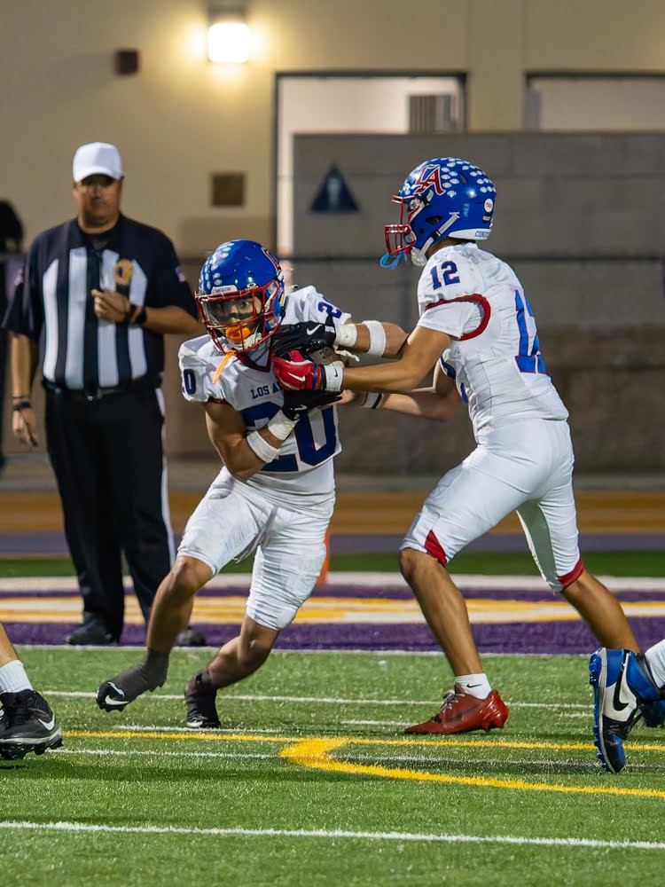 Los Altos running back fights through a tackle from a Diamond Bar defender during their 49-35 comeback win to remain undefeated at 9-0.
