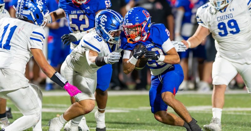 Los Altos running back fights through Chino defenders during a Hacienda League football game