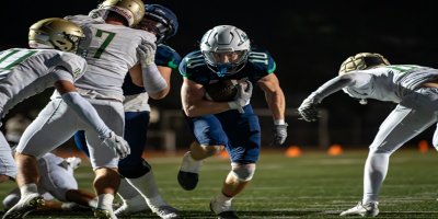 Chino Hills running back Jacob Jimenez powers through Mira Costa defenders during the CIF-SS Division 3 first-round playoff game.