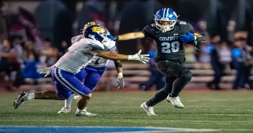Chino running back Hugo Vlillasenor stiff-arms a Diamond Bar defender during the Cowboys’ 42–9 Senior Night win.